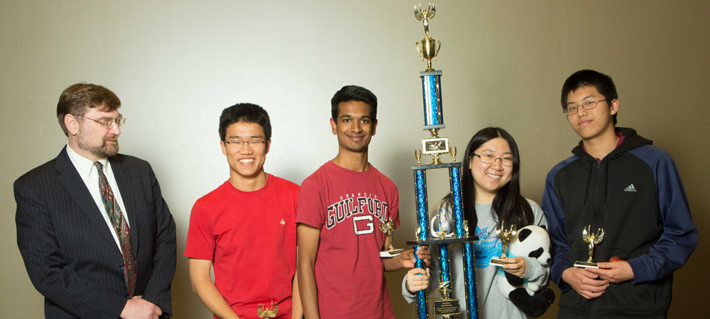 The Early College of Guilford (Greensboro, North Carolina) with their First-Place Open Division trophy from the 2018 Small School National Championship Tournament