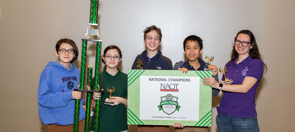 Hunter College High School&nbsp;A with their first-place trophy from the 2019 Middle School National Championship Tournament