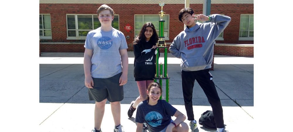 Longfellow Middle School&nbsp;A with their first-place trophy from the 2022 Middle School National Championship Tournament