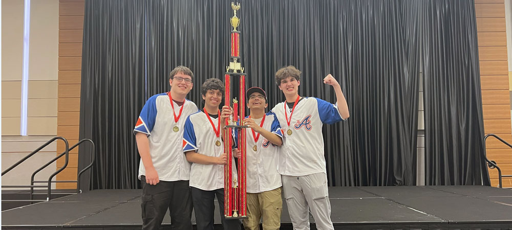 Barrington High School's A team with their first-place trophy from the 2023 High School National Championship Tournament
